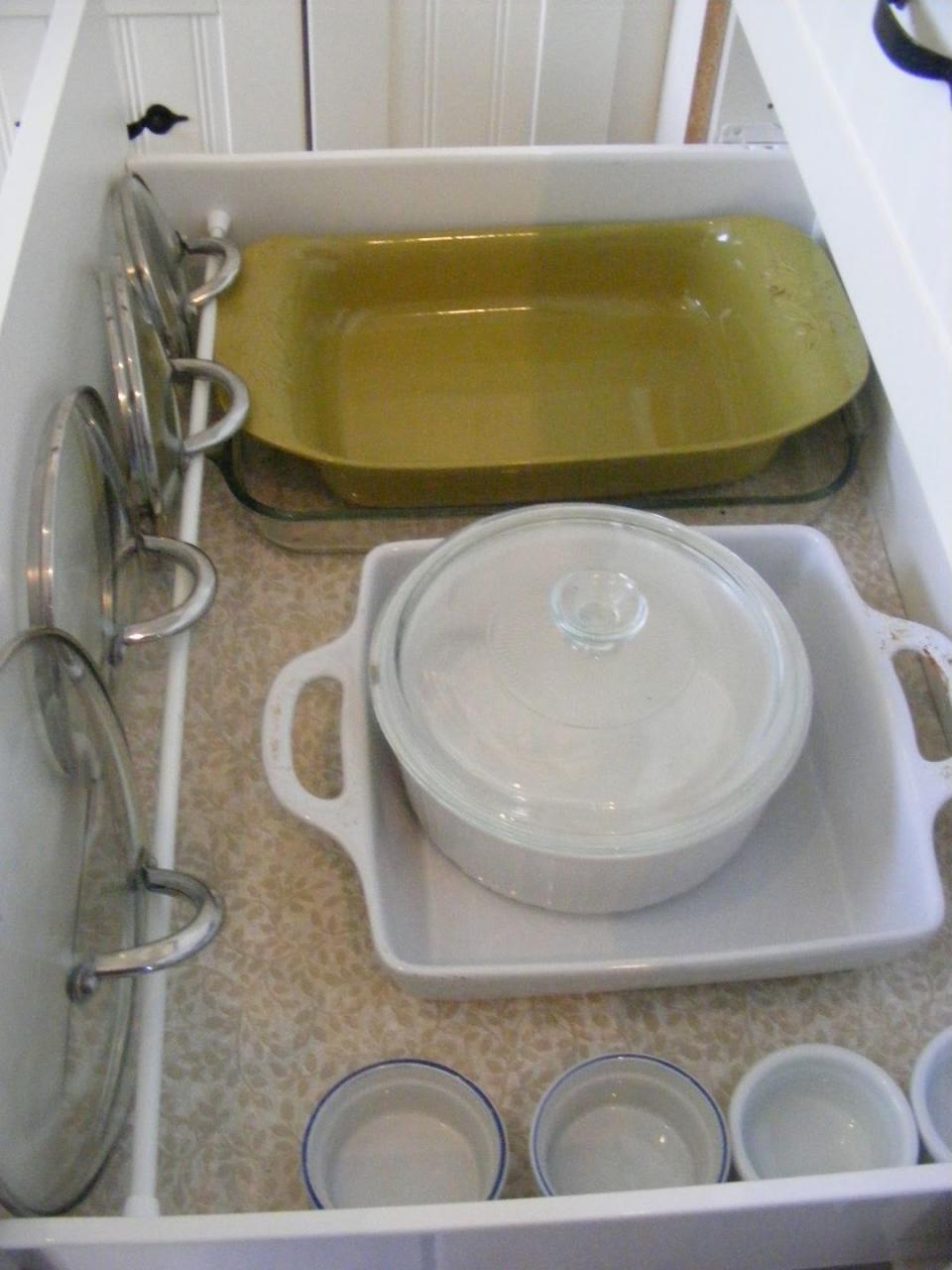 Organize Pot Lids With a Tension Rod