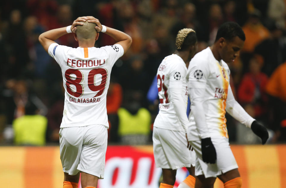 Galatasaray midfielder Sofiane Feghouli, left, reacts after missing a shot against Porto during the Champions League Group D soccer match between Galatasaray and Porto in Istanbul, Tuesday, Dec. 11, 2018. (AP Photo/Lefteris Pitarakis)