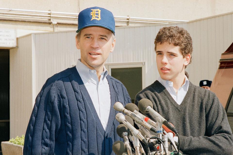 Then-Sen. Joseph Biden, D-Del., wearing a University of Delaware baseball cap, leaves Walter Reed Army Hospital accompanied by his son Hunter Biden, on March 24, 1988, in Washington, D.C. Biden had been hospitalized to receive an of a small umbrella-like filter in a vein to prevent blood clots from reaching his lungs.