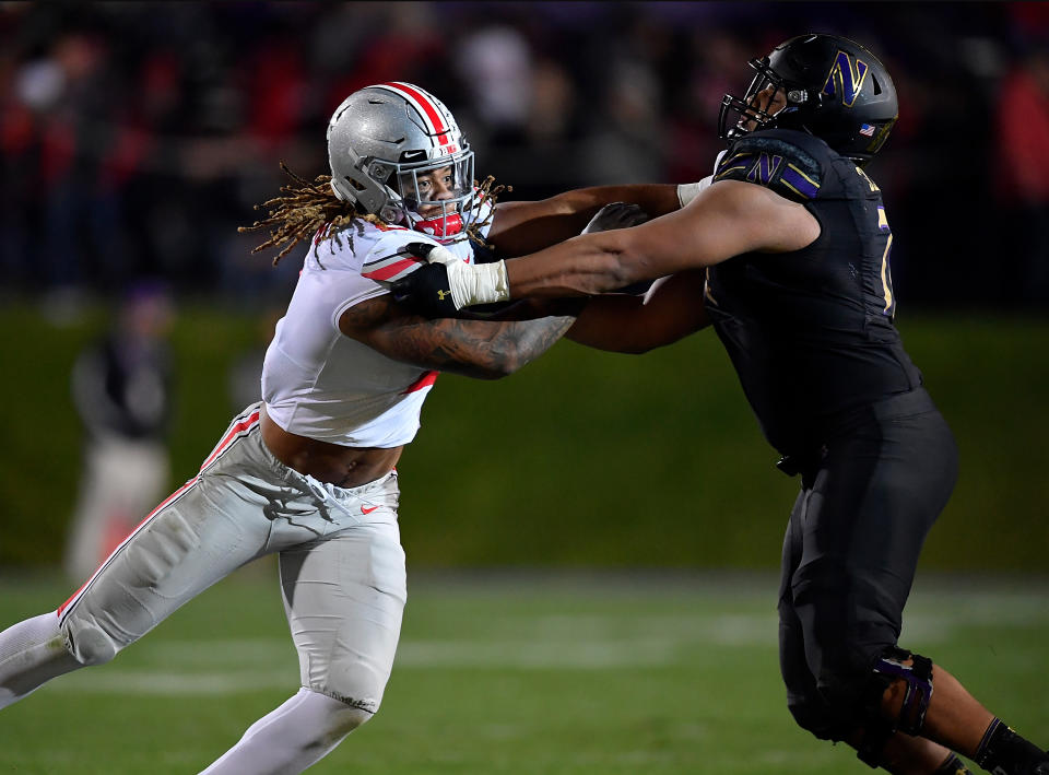 Northwestern OT Rashawn Slater, right, opened eyes in his 2019 battle with Ohio State's Chase Young, left. (Photo by Quinn Harris/Getty Images)