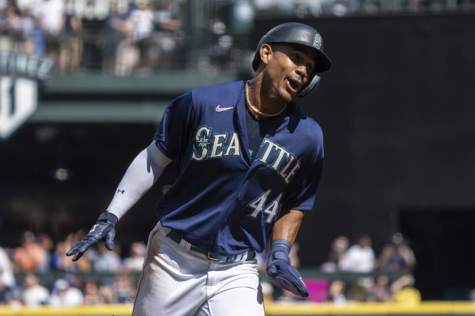 Seattle Mariners' Julio Rodriguez celebrates while rounding the bases a three-run home run by Mitch Haniger during the first inning a baseball game against the Cleveland Guardians, Thursday, Aug. 25, 2022, in Seattle. (AP Photo/Stephen Brashear)