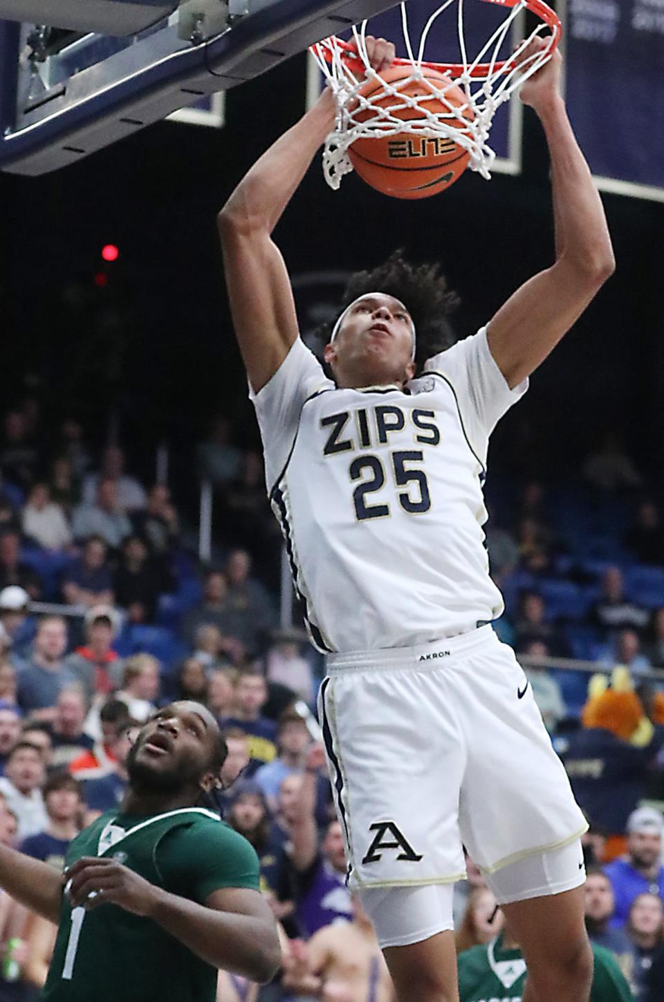 Akron's Enrique Freeman dunks against Eastern Michigan University during their MAC game at the University of Akron's James A. Rhodes Arena on Friday. The Zips beat the Eagles 104 to 67.