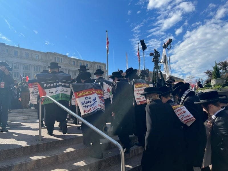 Pro-Palestine demonstrators march toward the White House.