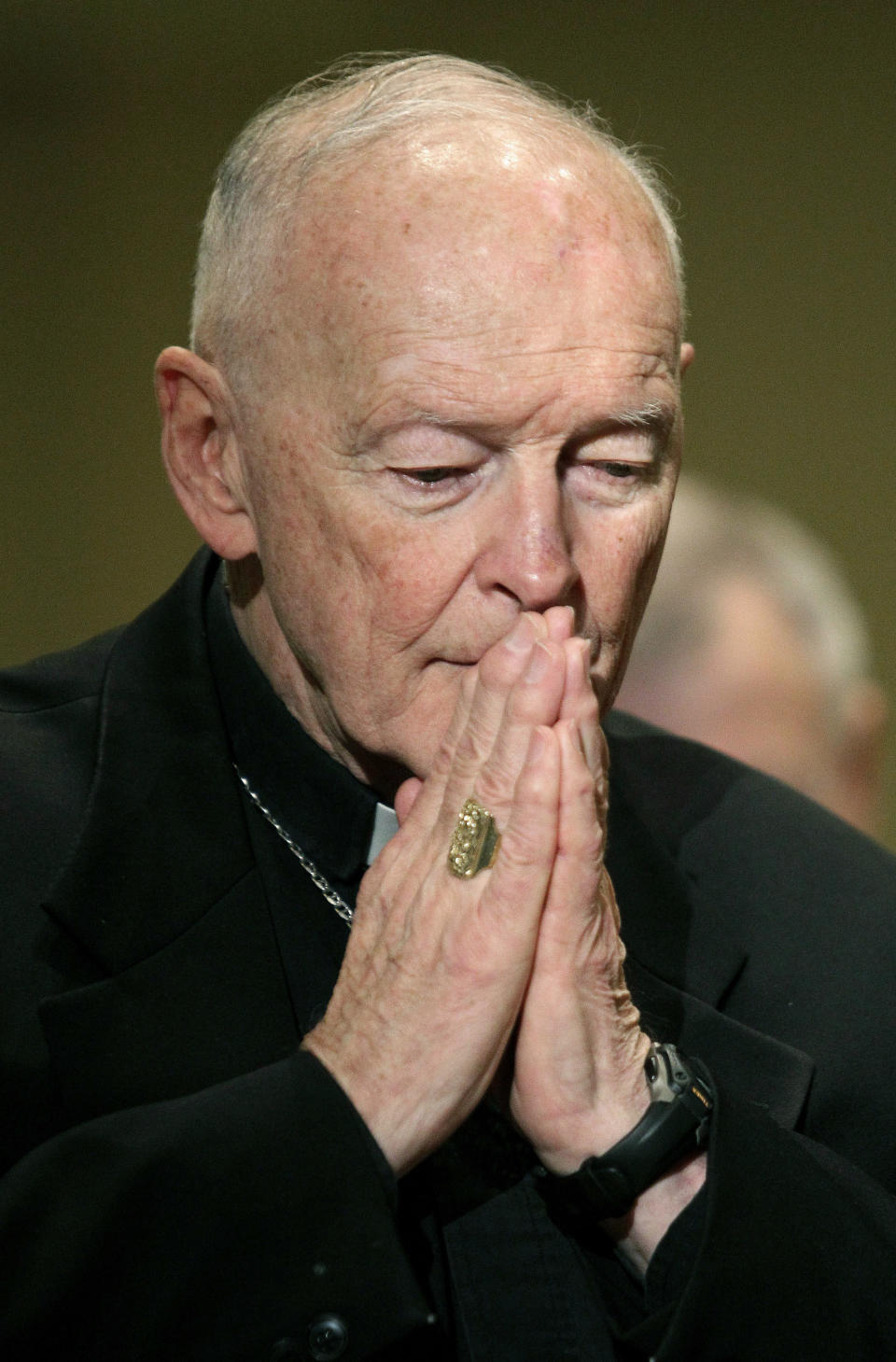 FILE - In this Nov. 14, 2011 file photo, Cardinal Theodore McCarrick prays during the United States Conference of Catholic Bishops' annual fall assembly in Baltimore. Pope Francis has accepted U.S. prelate Theodore McCarrick's offer to resign from the College of Cardinals following allegations of sexual abuse, including one involving an 11-year-old boy, and ordered him to conduct a "life of prayer and penance" in a home to be designated by the pontiff until a church trial is held, the Vatican said Saturday, July 28, 2018. (AP Photo/Patrick Semansky, File)