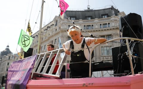 Emma Thompson talks to members of the media from atop the pink boat - Credit: TOLGA AKMEN/AFP/Getty Images