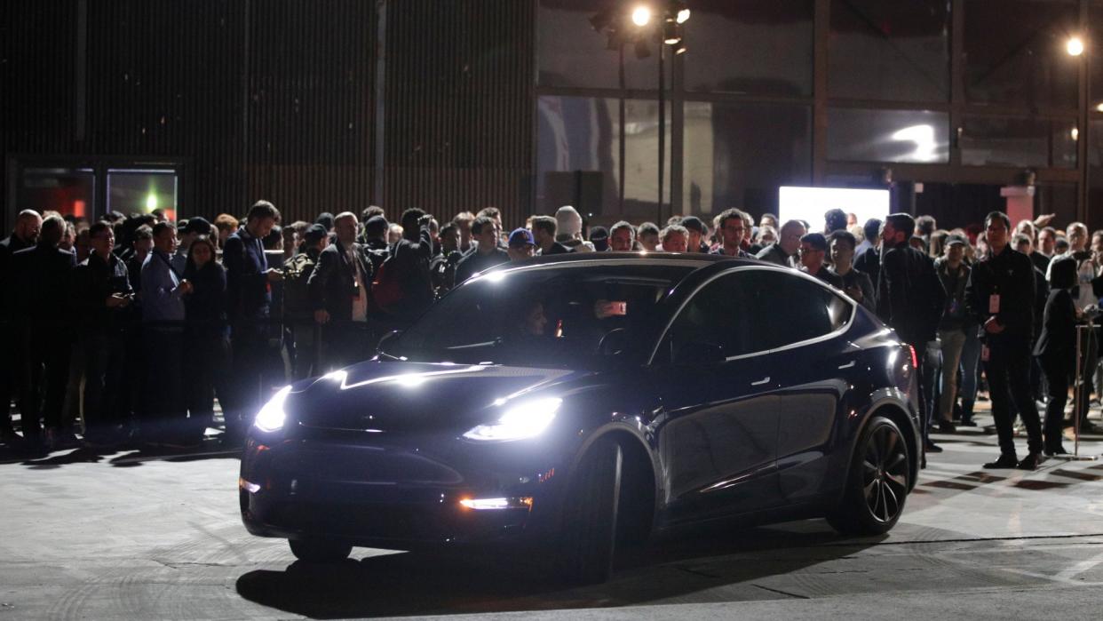 Mandatory Credit: Photo by Jae C Hong/AP/Shutterstock (10156342e)People wait outside Tesla's design studio for a test drive of the Model Y, in Hawthorne, Calif.