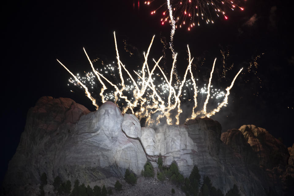 FILE - In this July 3, 2020, file photo, fireworks light the sky over the Mount Rushmore National Memorial near Keystone, S.D. South Dakota Gov. Kristi Noem sued the U.S. Department of Interior on Friday, May 30, 2021, in an effort to see fireworks shot over Mount Rushmore National Monument on Independence Day. The Republican governor successfully pushed last year for a return of the pyrotechnic display after a decade long hiatus. (AP Photo/Alex Brandon File)
