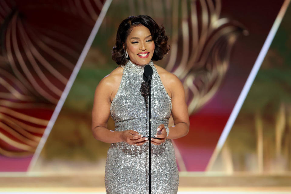 Angela Bassett accepts the Best Supporting Actress in a Motion Picture award.