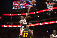 Miami Heat center Bam Adebayo (13) shoots over Atlanta Hawks forward Onyeka Okongwu (17) during the second half of an NBA basketball game Friday, Jan. 21, 2022, in Atlanta. (AP Photo/Hakim Wright Sr.)