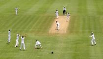 Cricket - West Indies v England - Second Test - National Cricket Ground, Grenada - 21/4/15 England's Chris Jordan celebrates the wicket of West Indies' Devon Smith who was caught by Jos Buttler Action Images via Reuters / Jason O'Brien