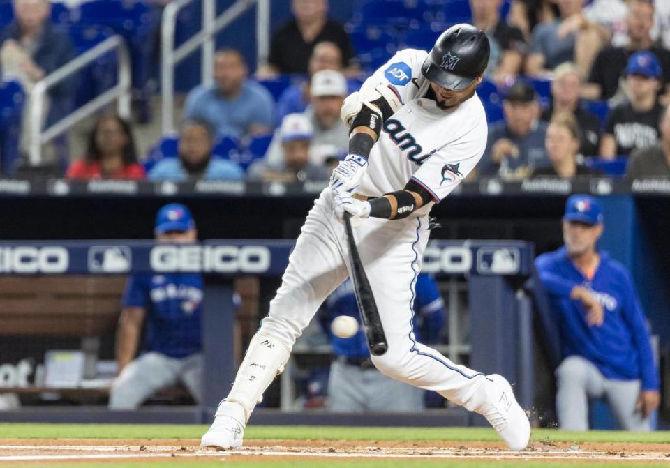 Miami Marlins second baseman Luis Arraez (3) hits a single against the Toronto Blue Jays in the first inning of an MLB game at loanDepot park on Monday, June 19, 2023, in Miami, Fla.