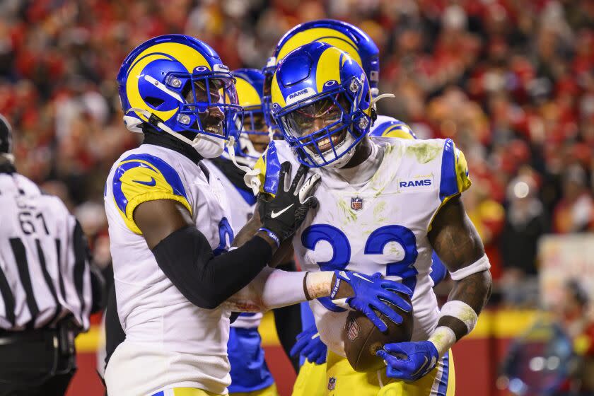 Los Angeles Rams safety Nick Scott (33) celebrates with teammates after making an interception.