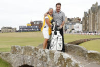 England's Nick Faldo and his former caddie Fanny Sunneson poses for a photo on the Swilken Bridge during a 'Champions round' as preparations continue for the British Open golf championship on the Old Course at St. Andrews, Scotland, Monday July 11, 2022. The Open Championship returns to the home of golf on July 14-17, 2022, to celebrate the 150th edition of the sport's oldest championship, which dates to 1860 and was first played at St. Andrews in 1873. (AP Photo/Peter Morrison)