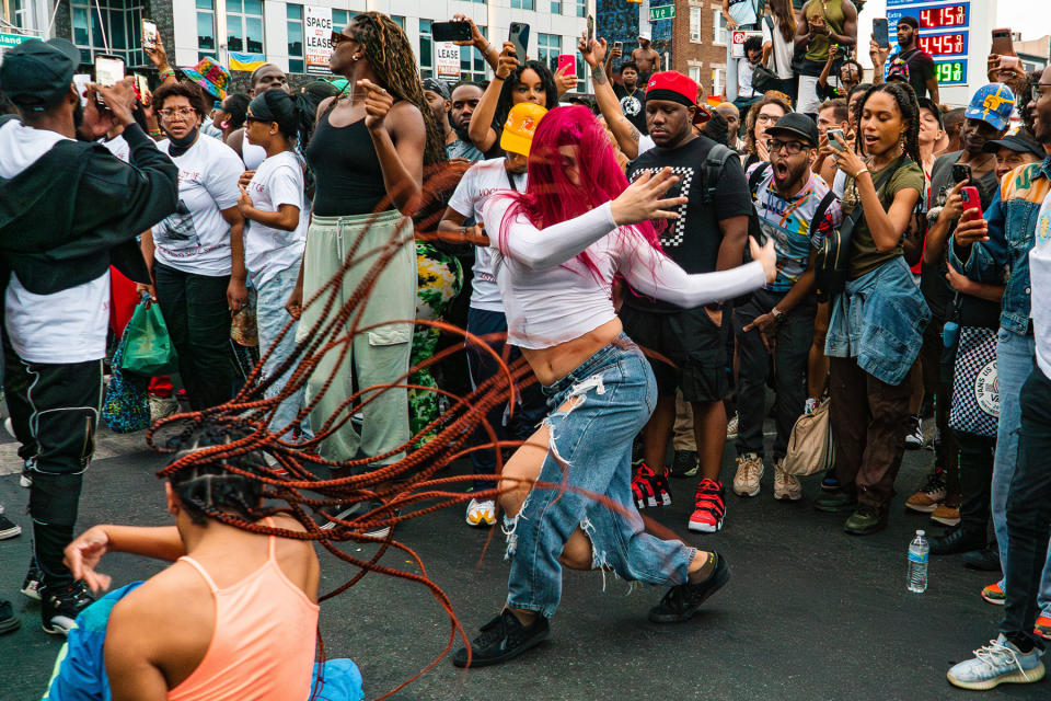 Supporters from the community vogue in the streets of Brooklyn on Friday.