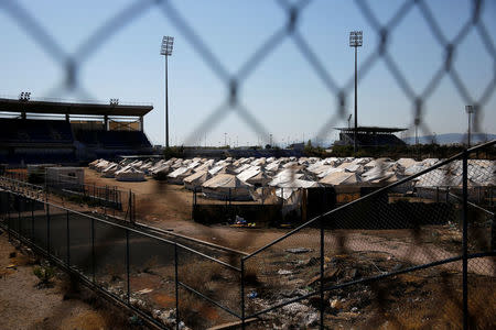 Tents are set at the old baseball venue of the former Hellenikon Olympic complex, which is used as a shelter for refugees and migrants, in Athens, Greece, July 13, 2016. Picture taken July 13, 2016. REUTERS/Alkis Konstantinidis