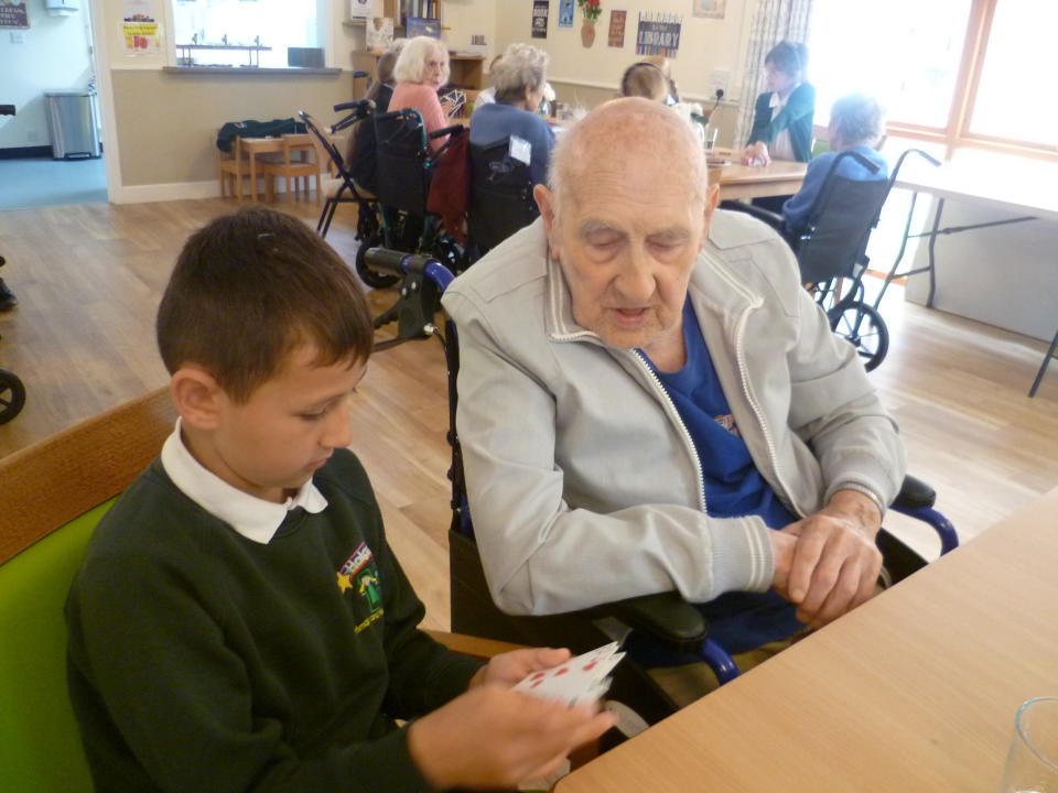 Boy and man sitting together 