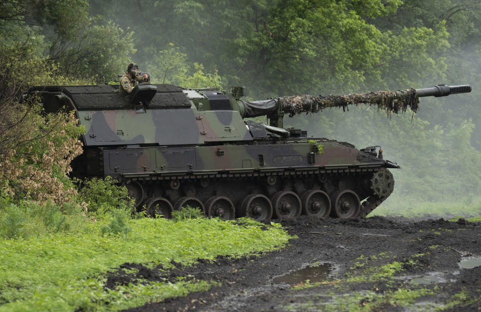 A Ukrainian army, German self-propelled Panzerhaubitze 2000, artillery is seen at its position at the frontline near Bakhmut, Donetsk region, Ukraine, Saturday, May 27, 2023. (AP Photo/Efrem Lukatsky)