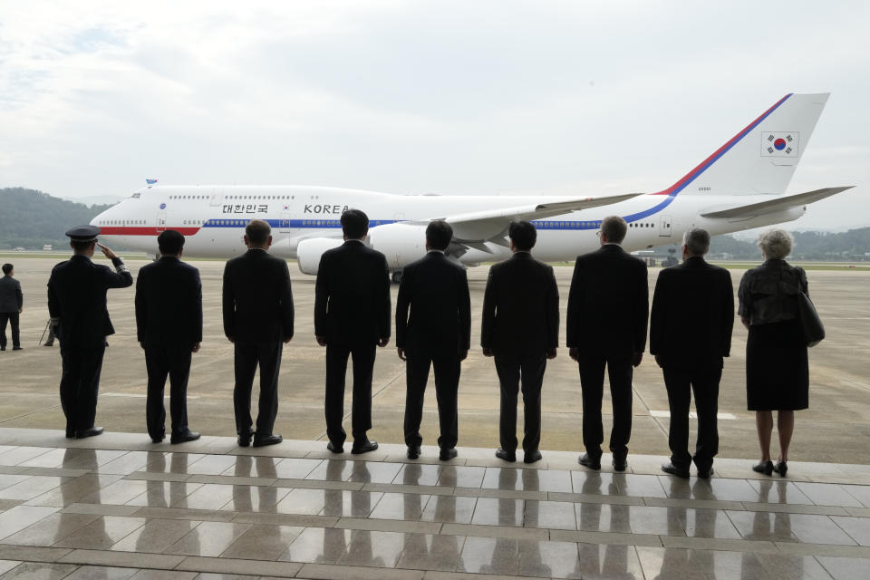 Well-wishers watch the airplane with South Korean President Yoon Suk Yeol onboard as he departs for London to attend the funeral for Queen Elizabeth II, at the Seoul military airport in Seongnam, South Korea on Sept. 18, 2022. Yoon’s office told MBC it wouldn’t provide the broadcaster with “reporting assistance” over his upcoming trips to Cambodia and Indonesia for the Association of Southeast Asian Nations and Group of 20 meetings because of what it described as "repeated distortion and biased reporting" on diplomatic issues. (AP Photo/Ahn Young-joon)