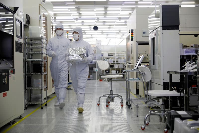Employees work at a clean room of National Nanofab Center in Daejeon