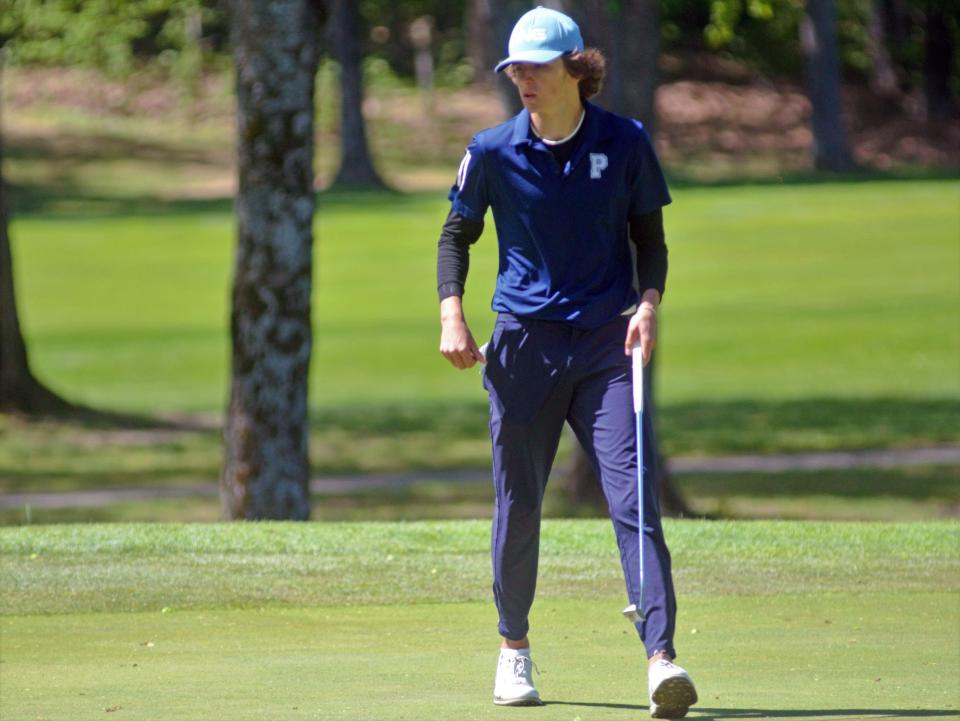 Petoskey's Max Faulkner looks over his putt during Wednesday's Big North Conference championships in Gaylord.