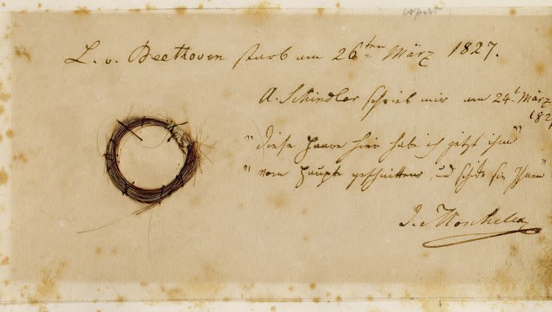 This photo provided by the Ira F. Brilliant Center for Beethoven Studies at San Jose State University in March 2023, shows the Moscheles Lock, from composer Ludwig van Beethoven, with an inscription by former owner Ignaz Moscheles. Hundreds of years after Beethoven’s death, researchers have pulled DNA from strands of his hair — and found clues about what killed him, according to a study published Wednesday, March 22, 2023.