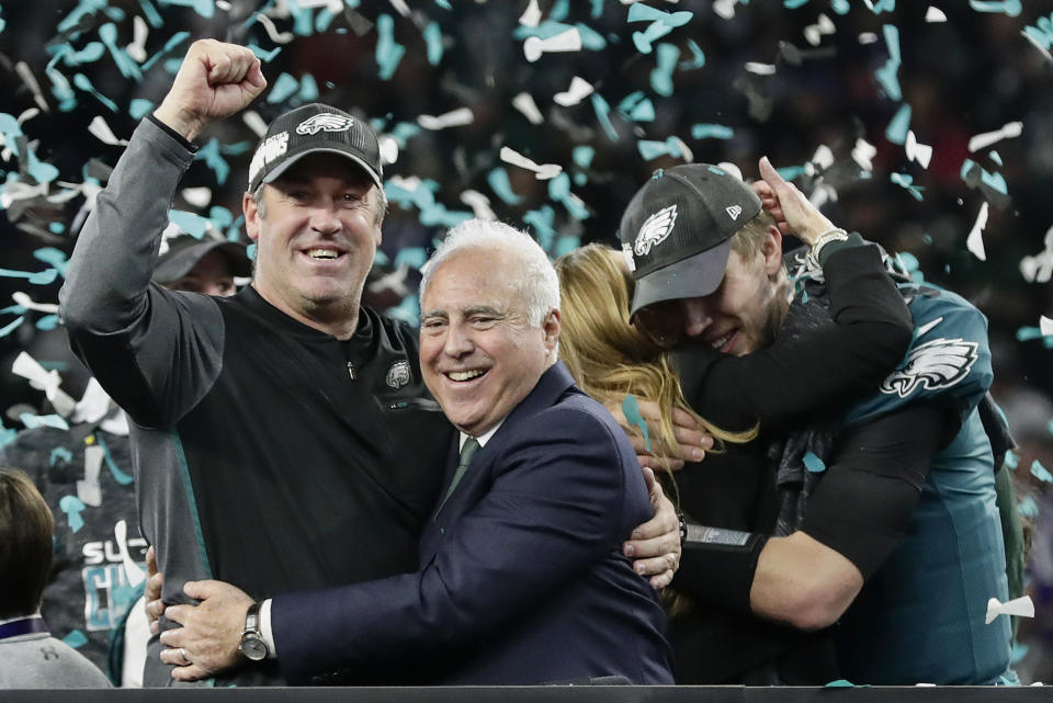 Philadelphia Eagles head coach Doug Pederson, left, hugs owner Jeffrey Lurie after Super Bowl LII. (AP)