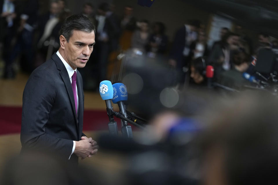 FILE - Spain's Prime Minister Pedro Sanchez speaks with the media as he arrives at the European Council building in Brussels, on Oct. 26, 2023. Spain's Socialist Party has struck a deal with a fringe Catalan separatist party to grant an amnesty for potentially thousands of people involved in the region's failed secession bid in exchange for its key backing of acting Spanish Prime Minister Pedro Sánchez to form a new government. Socialist lawmaker and party official Santos Cerdán announced the deal on Thursday, Nov. 9, 2023, in Brussels. (AP Photo/Virginia Mayo)