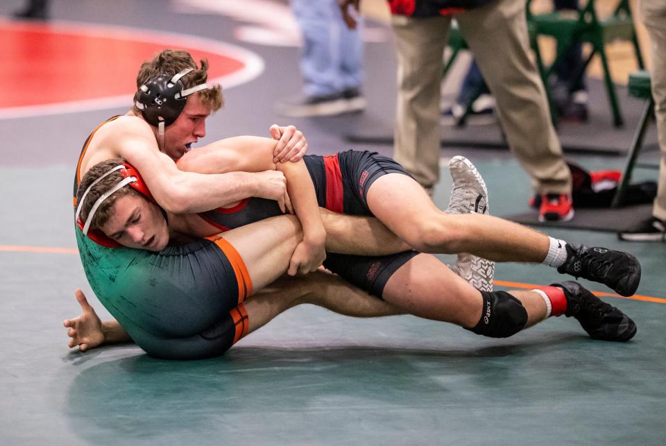 Dolphin Nick Hejke wrestles Michael Shannon, from New Smyrna High School, in the 145-pound final Saturday. Mosley High School hosted the regional wrestling tourney Saturday, February 28, 2021.