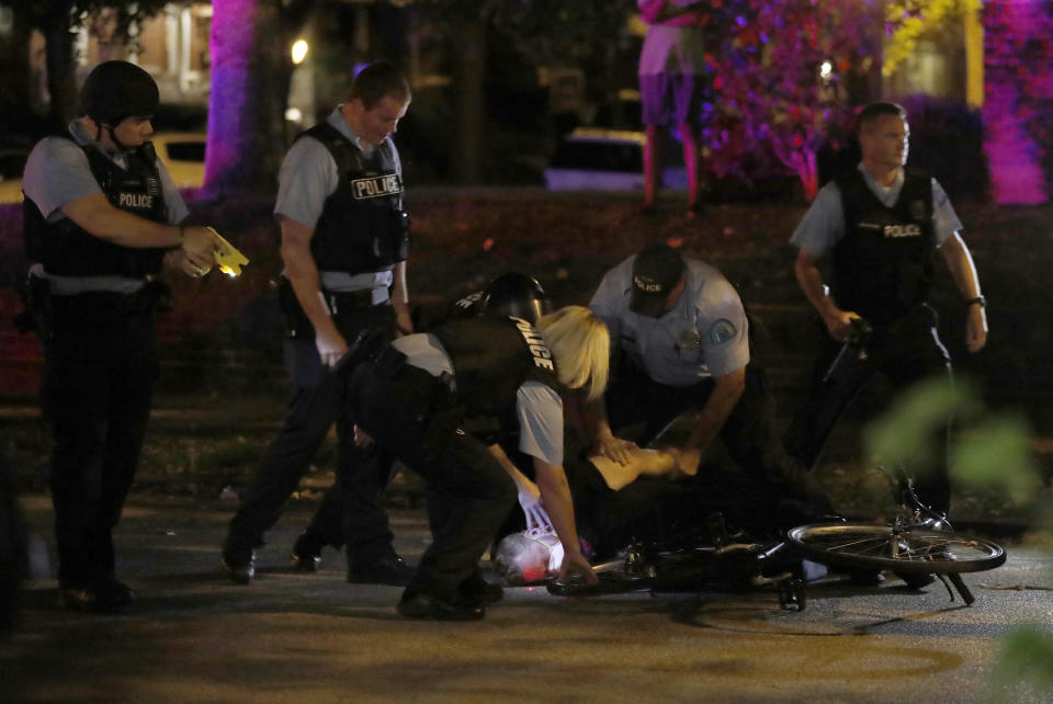 <p>Police arrest a protester as protesters gather, Friday, Sept. 15, 2017, in St. Louis, after a judge found a white former St. Louis police officer, Jason Stockley, not guilty of first-degree murder in the death of a black man, Anthony Lamar Smith, who was fatally shot following a high-speed chase in 2011. (Photo: Jeff Roberson/AP) </p>