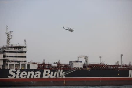 A helicopter of Iranian Revolutionary Guard flies over Stena Impero, a British-flagged vessel owned by Stena Bulk, at Bandar Abbas port
