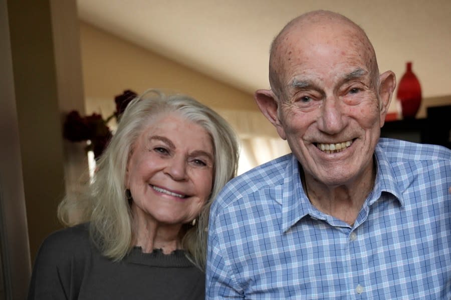 World War II veteran Harold Terens, 100, right, and Jeanne Swerlin, 96, pose for a photo, Thursday, Feb. 29, 2024, in Boca Raton, Fla. Terens will be honored by France as part of the country’s 80th anniversary celebration of D-Day. In addition, the couple will be married on June 8 at a chapel near the beaches where U.S. forces landed. (AP Photo/Wilfredo Lee)