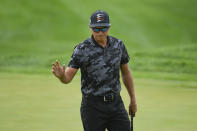 Rickie Fowler acknowledges the crowd after making a putt on the first hole during the first round of the 3M Open golf tournament in Blaine, Minn., Thursday, July 22, 2021. (AP Photo/Craig Lassig)