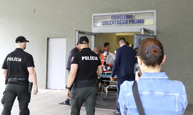 Rescue workers and policemen take Slovak Prime Minister Robert Fico, who was shot and injured, to a hospital in the town of Banska Bystrica, central Slovakia, Wednesday, May 15, 2024. (Jan Kroslak/TASR via AP)