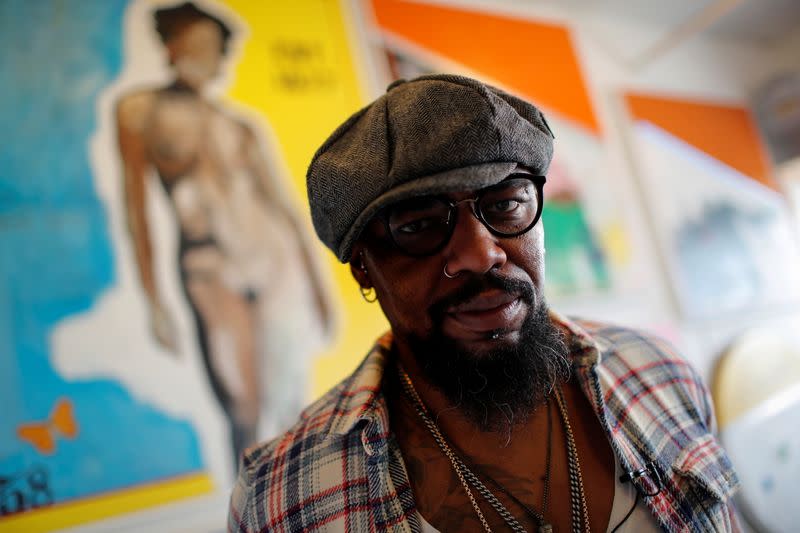 Artist Guy Stanley Philoche poses for a photograph in his studio in the Harlem section of New York