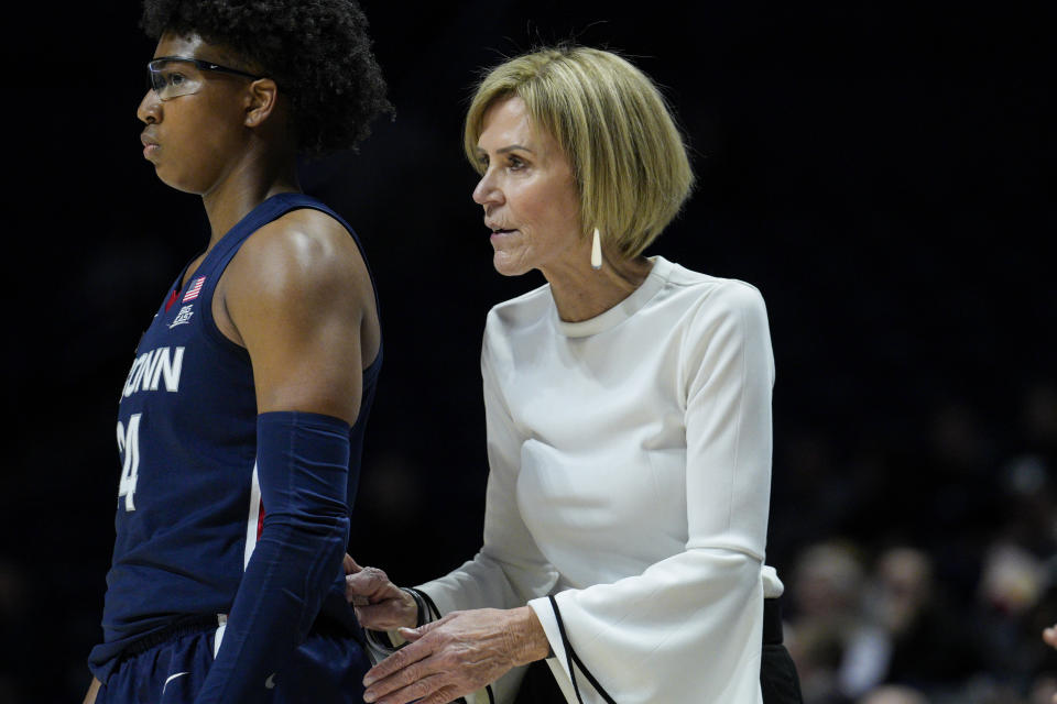 UConn associate head coach Chris Dailey, right, speaks to UConn's Ayanna Patterson during the second half of an NCAA college basketball game against Xavier, Thursday, Jan. 5, 2023, in Cincinnati. (AP Photo/Jeff Dean)