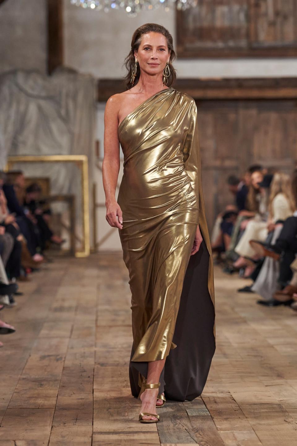 Christy Turlington closed the Ralph Lauren show in a gold gown. (IMAXTREE)