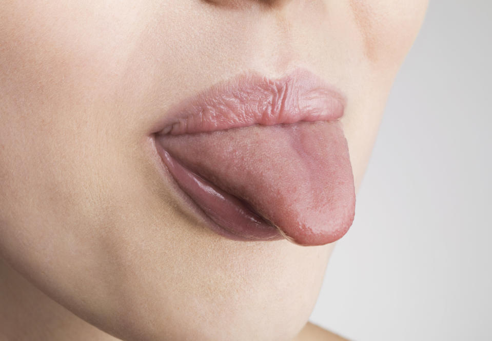 a person sticking their tongue out