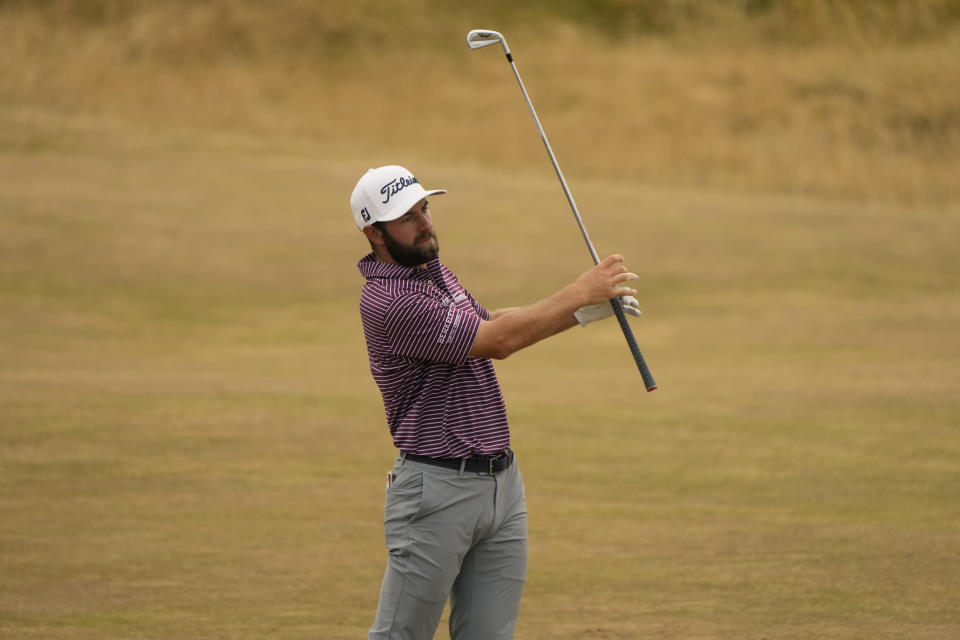 Cameron Young of the US watches his shot on the 6th hole during the final round of the British Open golf championship on the Old Course at St. Andrews, Scotland, Sunday July 17, 2022. (AP Photo/Gerald Herbert)