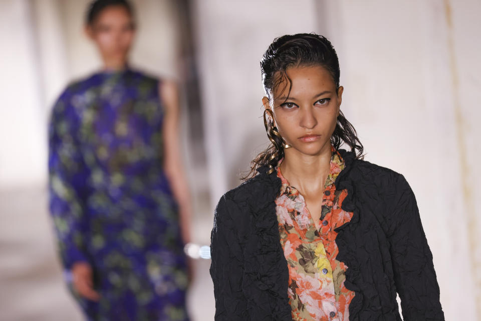 A model wears a creation for the Dries Van Noten ready-to-wear Spring/Summer 2023 fashion collection presented Wednesday, Sept. 28, 2022 in Paris. (Photo by Vianney Le Caer/Invision/AP)