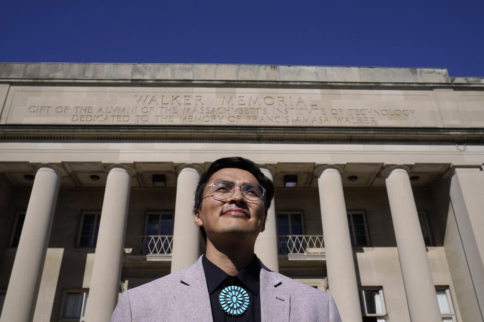 Alvin Donel Harvey, president of the Massachusetts Institute of Technology Native American Student Association, stands for a photograph, Thursday, Oct. 7, 2021, in front of the Walker Memorial building on the schools campus, in Cambridge, Mass. MIT is grappling with the legacy of one of its founding fathers, whose name graces the iconic building. Francis Amasa Walker was a former head of the U.S. office of Indian Affairs who authored The Indian Question, a notorious treatise on Native Americans that helped justify the nation's tribal reservation system. (AP Photo/Steven Senne)