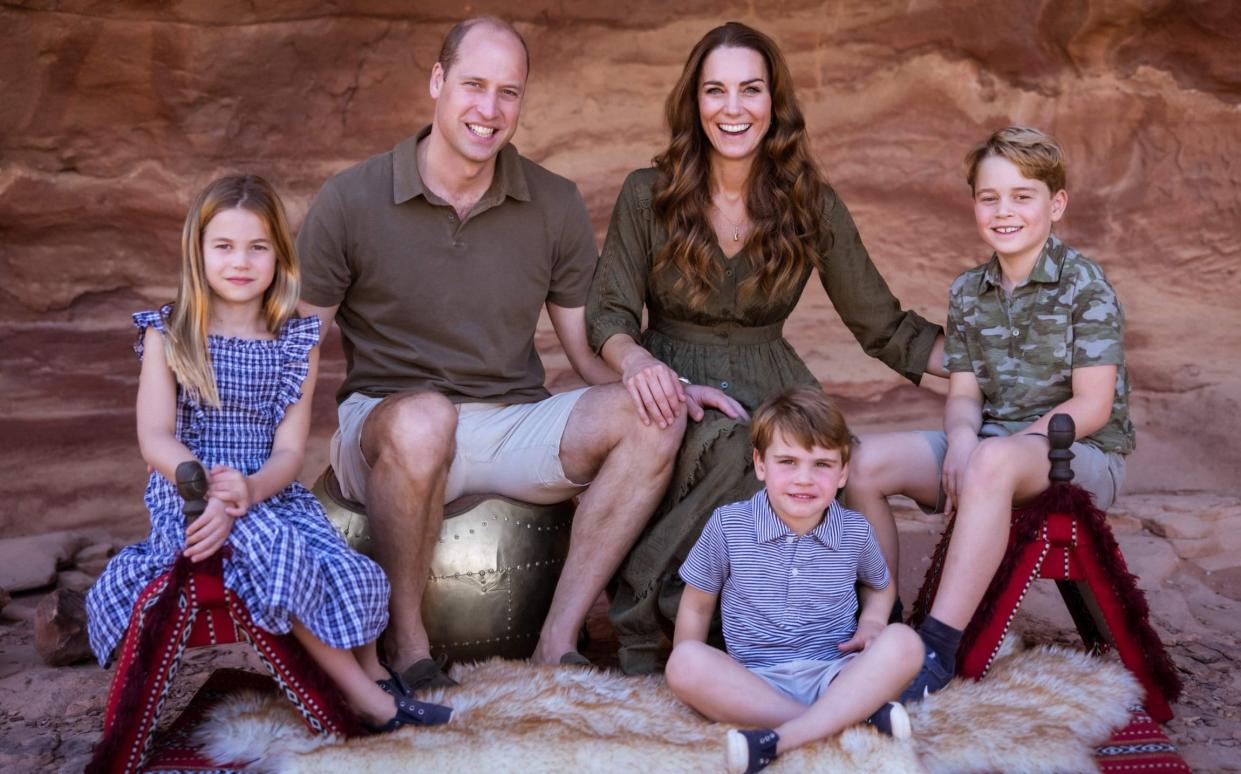 The Cambridge family's 2021 Christmas card photo - AFP