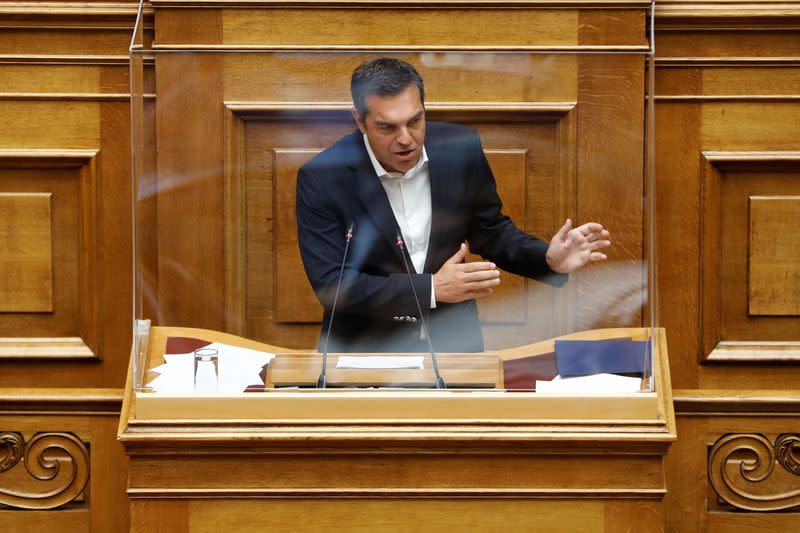 Greek PM Mitsotakis addresses lawmakers during a parliamentary on a wiretapping case in Athens