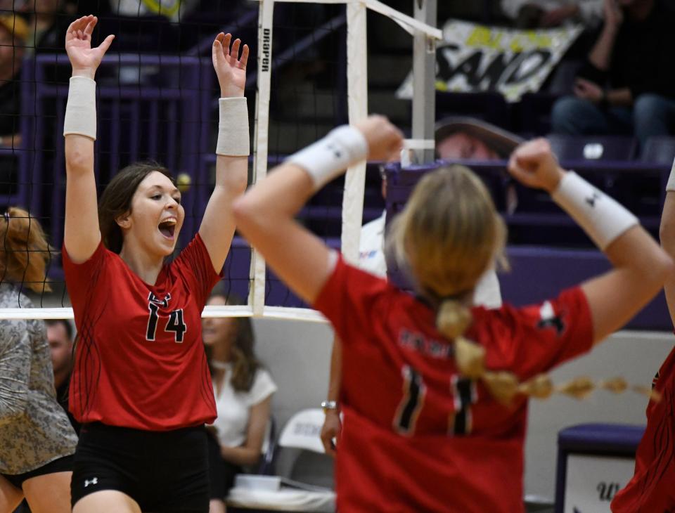 Lubbock-Cooper's Kennedy Venable (14) celebrates a point against Amarillo High in a regional quarterfinal match Tuesday, Nov. 8, 2022, at Kenneth Cleveland Gymnasium in Dimmitt.