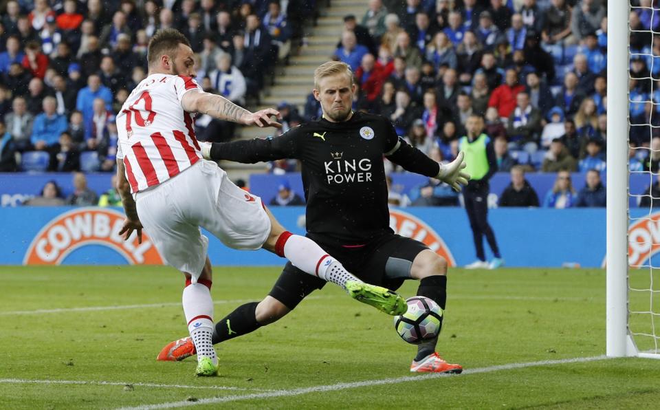 <p>Leicester City’s Kasper Schmeichel saves from Stoke City’s Marko Arnautovic </p>