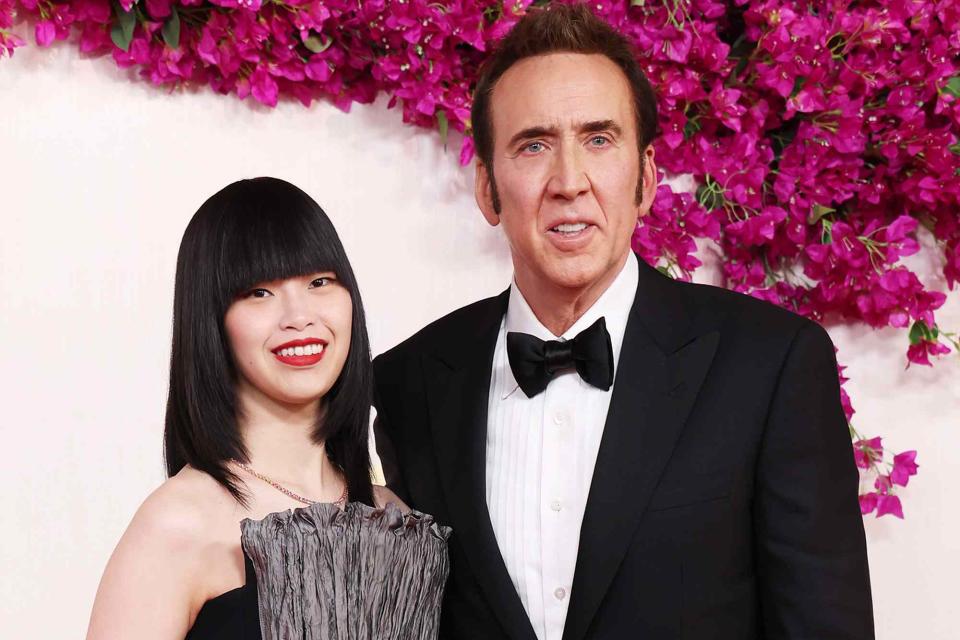 <p>Kevin Mazur/Getty</p> Riko Shibata and Nicolas Cage at the 2024 Oscars on March 10, 2024