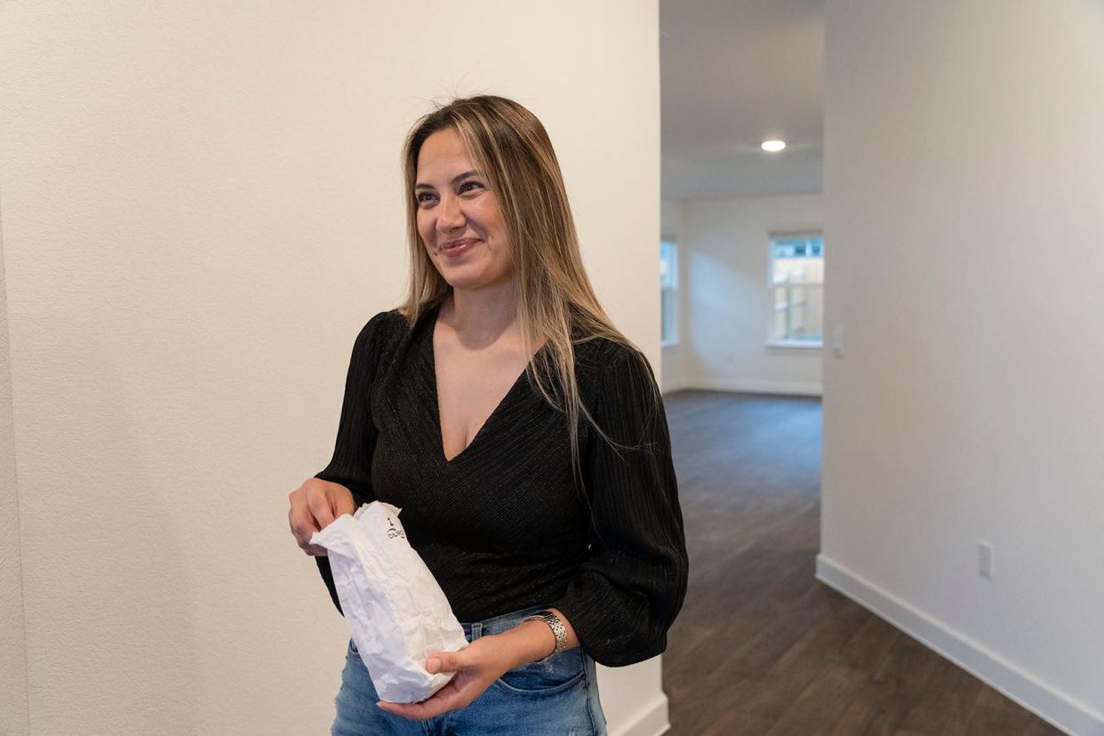 Nidia Gomez checks out her new home. "The location here in Hutto is great," she said. "We did want to stay in Austin, but prices are way too high and definitely less square feet. The schools here also seem to be better ranking than in Austin."