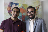 In this Jan. 6, 2020, photo, Michael Navas Gomez, left, poses for a photo with his attorney, Joshua Greer at his office in Los Angeles. Navas Gomez, who was detained in a remote detention facility in Louisiana for five months, was lucky to have a lawyer who helped him navigate the immigration court system. (AP Photo/Damian Dovarganes)