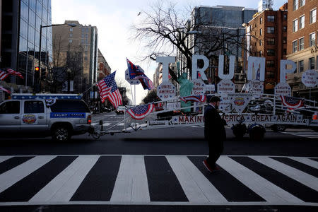 Rob Cortis of Detroit, Michigan drives his modified Trump Unity Bridge trailer through downtown Washington. REUTERS/James Lawler Duggan