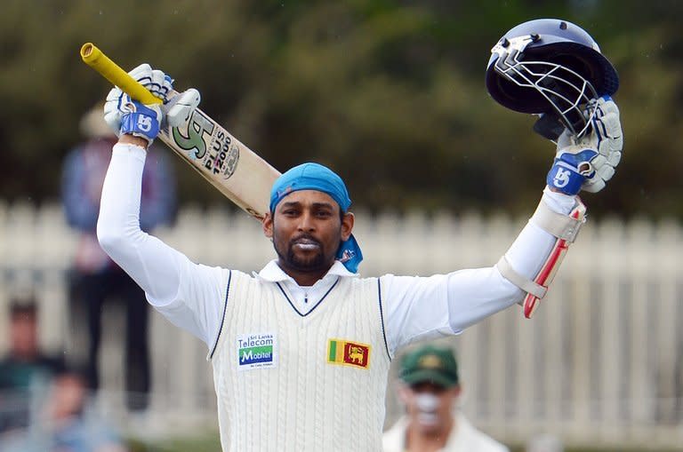 Sri Lanka's Tillakaratne Dilshan celebrates after scoring a century in the first Hobart Test on December 16, 2012. Dilshan and prospective captain Angelo Mathews put on 161 runs before they were separated with the score on 248 as Sri Lanka closed in on the follow-on target