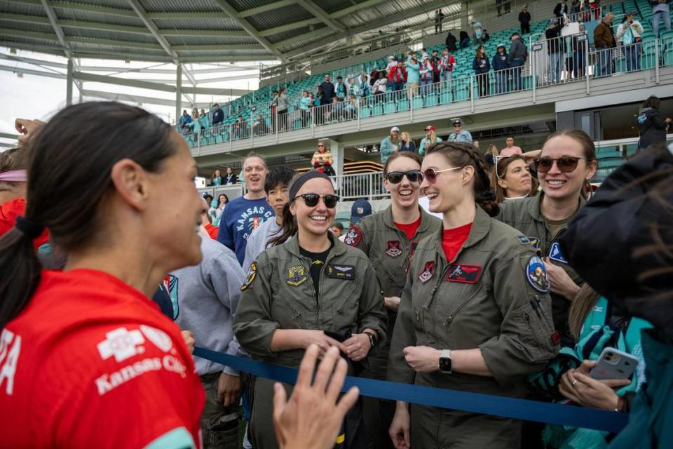 Kansas City Current midfielder Lo’eau LaBonta greets the all-woman pilots from Whiteman Air Force Base who flew the first all-female, two-ship T-38 flyover over the new CPKC Stadium on Saturday, March 16, 2024, in Kansas City.